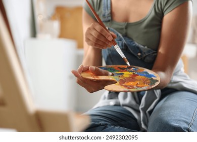 Woman drawing picture with paint in studio, closeup - Powered by Shutterstock