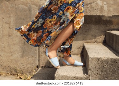 Woman in dress climbing stairs with sandals, summer sandals, beach sandals, summer sandal