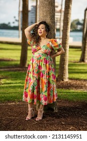 Woman In A Dress Leaning On A Palm Tree In Miami Beach