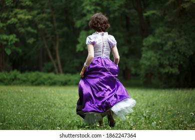 Woman In Dress Running Away Towards Forest, Fear Concept