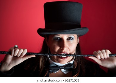 Woman Dressed Like A Circus Ringmaster With Whip