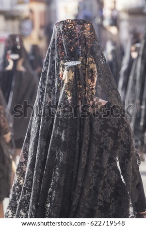 Woman dressed in mantilla during a procession of holy week, Spain
