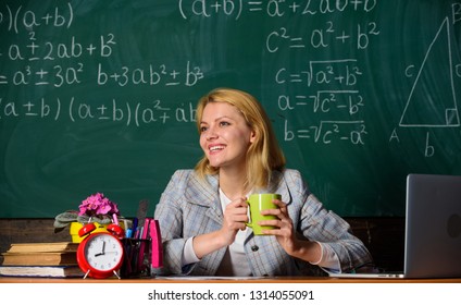 Woman Drink Coffee In Classroom. Teacher With Alarm Clock At Blackboard. Time. Back To School. Teachers Day. Study And Education. Modern School. Knowledge Day. School. Home Schooling. Happy Woman.