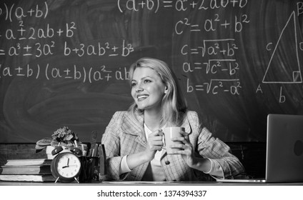 Woman Drink Coffee In Classroom. Teacher With Alarm Clock At Blackboard. Time. Back To School. Teachers Day. Study And Education. Modern School. Knowledge Day. School. Home Schooling. Happy Woman.