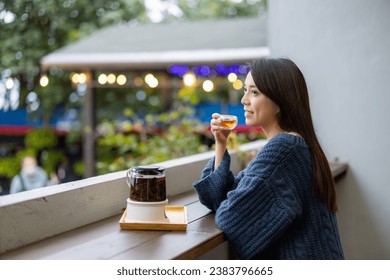 Woman drink of tea at coffee shop - Powered by Shutterstock