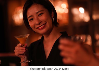 Woman Drinking At The Bar 
