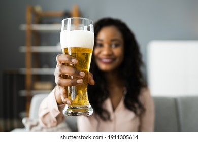 Woman Drinking Beverage Beer In Video Conference At Home
