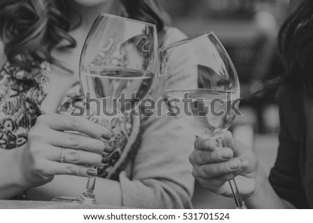 woman drinking champagne in a cafe