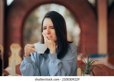 
Woman Drinking Coffee Feeling Tooth Pain From Teeth Sensitivity. Young Person Feeling Discomfort From Having A Hot Beverage
