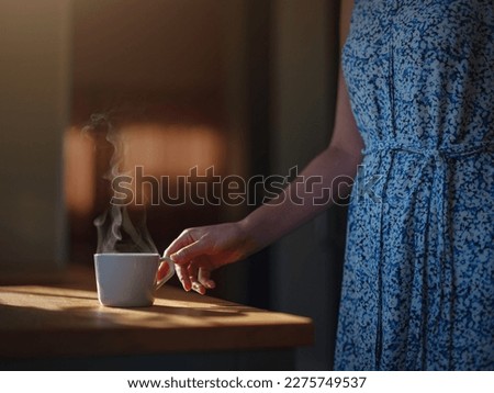 Woman is drinking coffee , morning routine. Tiny house. First property. Small apartment interior design. Minimalism. Moving in. Living alone. Charming trailer house with the morning sun