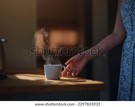 Woman is drinking coffee , morning routine. Tiny house. First property. Small apartment interior design. Minimalism. Moving in. Living alone. Charming trailer house with the morning sun