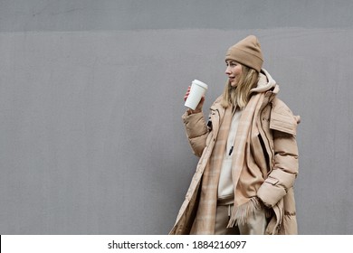 Woman drinking coffee outdoor. Color of the year 2021: ultimate gray. Trendy colors concept, mockup with copy space