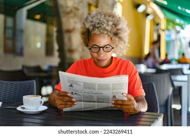 Woman drinking coffee and reading newspaper at cafe. Leisure and news concept - Powered by Shutterstock