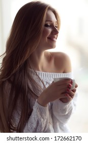 Woman Drinking Coffee  (soft Focus On The Eyes)