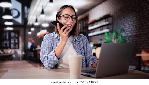 Woman Drinking Coffee And Working On Laptop. Sending Voice Message On Phone - Powered by Shutterstock