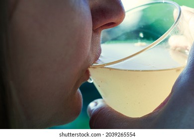 Woman Is Drinking Dirty Water From The Glass Cup
