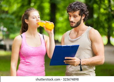 Woman Drinking Energy Drink After Running