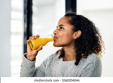 Woman Drinking Fresh Orange Juice