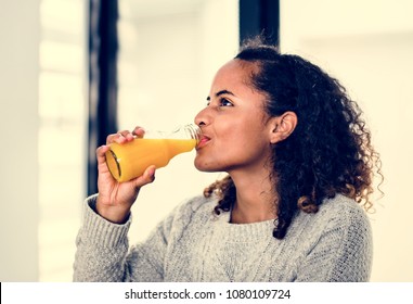 Woman Drinking Fresh Orange Juice