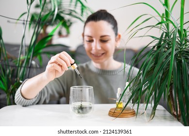 Woman Drinking Glass With Chlorophyll Water, Antioxidant Beverage. Healthy Lifestyle 