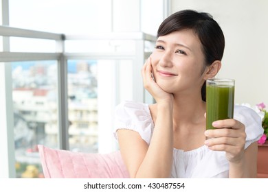 Woman Drinking A Glass Of Juice