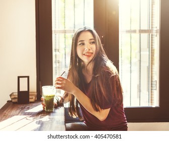 Woman Drinking Iced Green Tea Concept