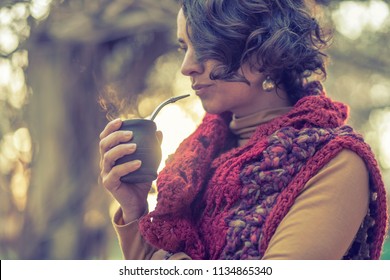 woman drinking a mate