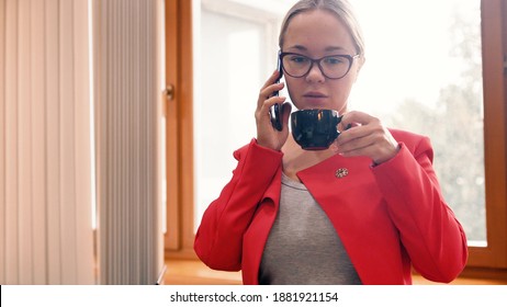 A Woman Is Drinking Morning Coffee In Her Office. Slow Motion