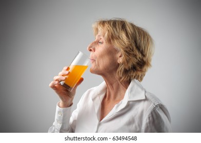 Woman Drinking Orange Juice