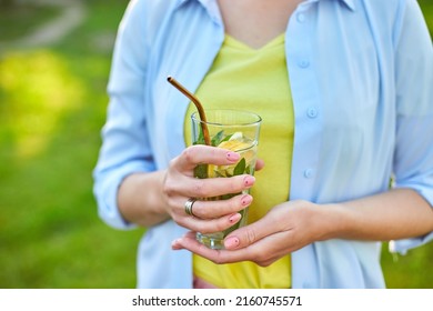 Woman Drinking Summer Citrus Lemonade With Reusable Metal Straws Party In A Backyard House With Cold Drink, Summertime, Eco Friendly Drinking Straw, Healthy Lifestyle, Vegetarian Food, Detox Water