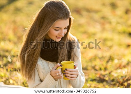 woman drinking tea outdoors