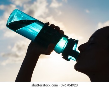 Woman drinking water. 