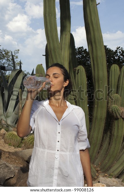 Woman Drinking Water Bottle Front Cactus Stock Photo Edit Now 99008126