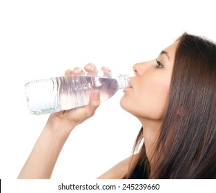 Woman drinking water from plastic bottle  isolated on a white background