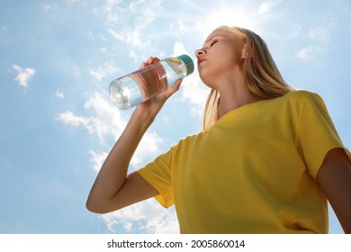 Woman Drinking Water To Prevent Heat Stroke Outdoors