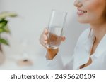 Woman Drinking Water and smiling