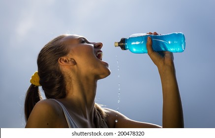 Woman Drinks Energy Drink After Long Run