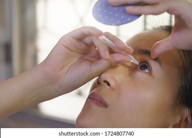 A Woman Is Dripping Artificial Tears