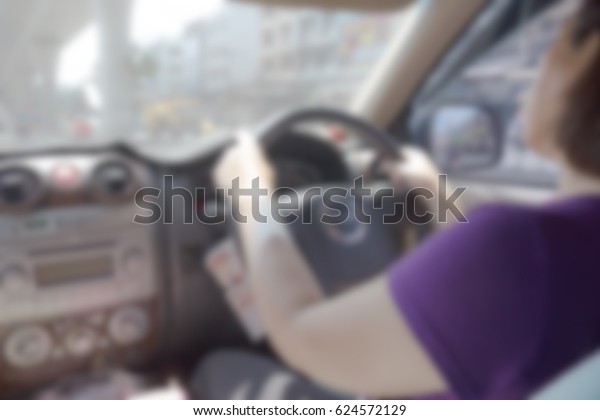 Woman drive
car blur background,Abstract
Blurred