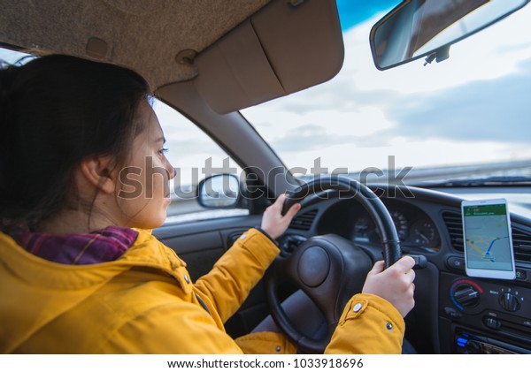 woman drive car in cold\
winter weather