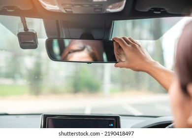 Woman Driver Adjusting Rear View Mirror A Car. Journey, Trip And Safety Transportation Concepts