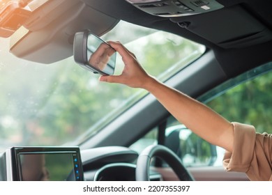 Woman Driver Adjusting Rear View Mirror A Car. Journey, Trip And Safety Transportation Concepts