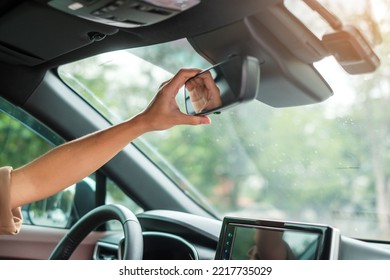 Woman Driver Adjusting Rear View Mirror A Car. Journey, Trip And Safety Transportation Concepts