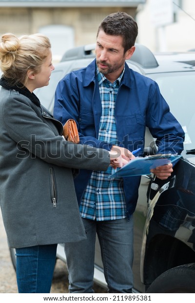woman\
driver and angry man arguing about car\
damage