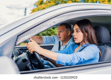 Woman Driver - Car Accident, Yells In Fear Or Frustration. Student Girl Sitting Scared In A Car. Incident Happens. Car Crash Accident With A Scared Driver And A Instructor