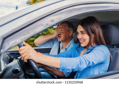 Woman Driver - Car Accident, Yells In Fear Or Frustration. Student Girl Sitting Scared In A Car. Incident Happens. Car Crash Accident With A Scared Driver And A Instructor