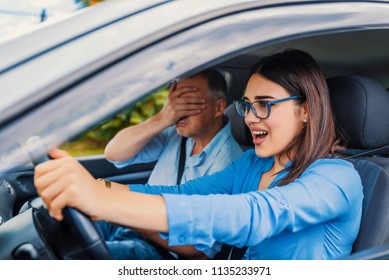 Woman Driver - Car Accident, Yells In Fear Or Frustration. Student Girl Sitting Scared In A Car. Incident Happens. Car Crash Accident With A Scared Driver And A Instructor