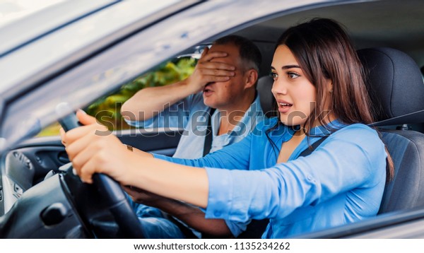 Woman Driver - Car\
Accident, yells in fear or frustration. Student girl sitting scared\
in a car. incident happens. Car Crash Accident with a Scared Driver\
and a instructor