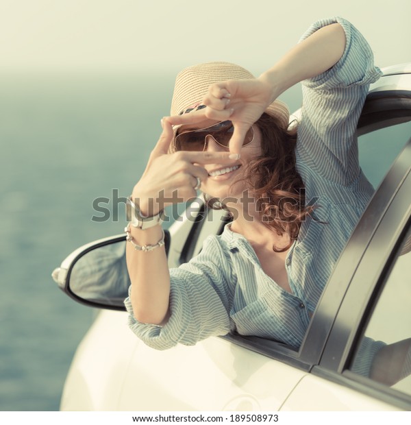 Woman driver\
in the car. Summer vacation\
concept