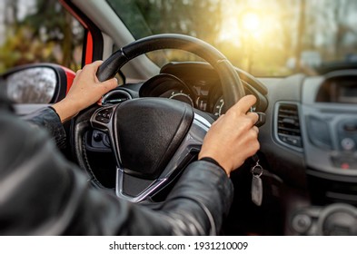 Woman Driver Driving A Car. View From Inside The Cabin.